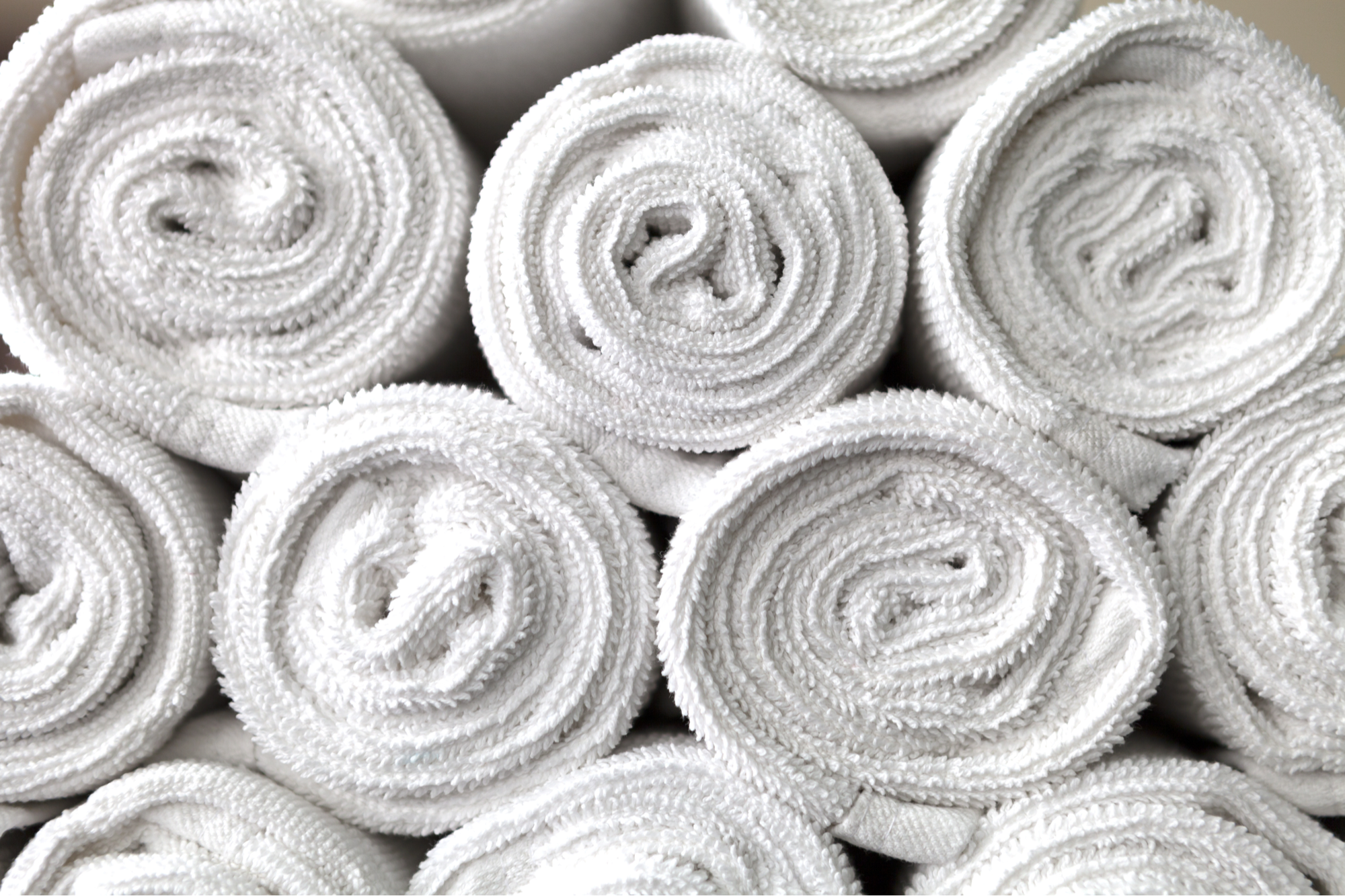 Stack of white rolled towels